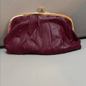 Elegant Burgundy Clutch with Gold Accents